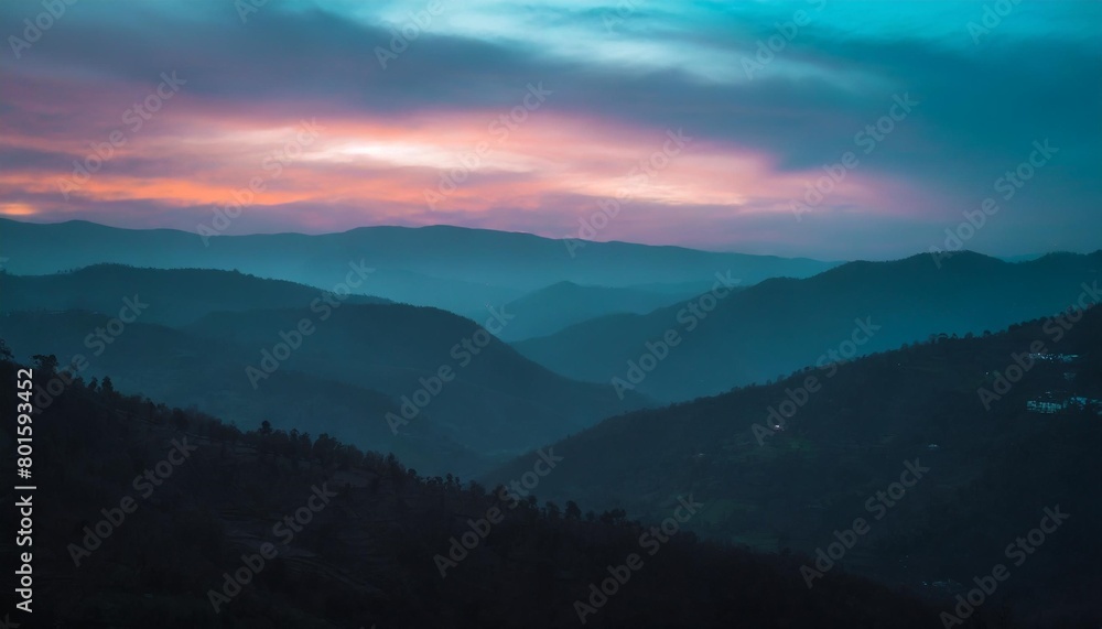 amazing landscape in the layers of mountains at the dusk view of colorful sky and hills covered by forest