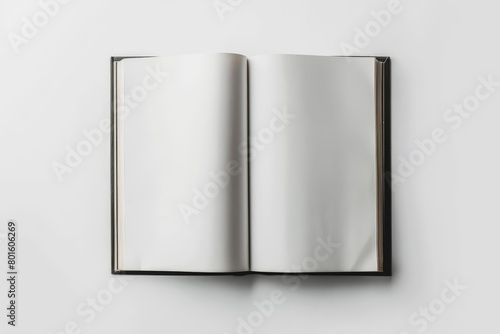 A photo of an open book with blank pages on a white background