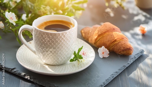 A Cup of Coffee and a Croissant on a Table, Morning Light, Boho Style photo