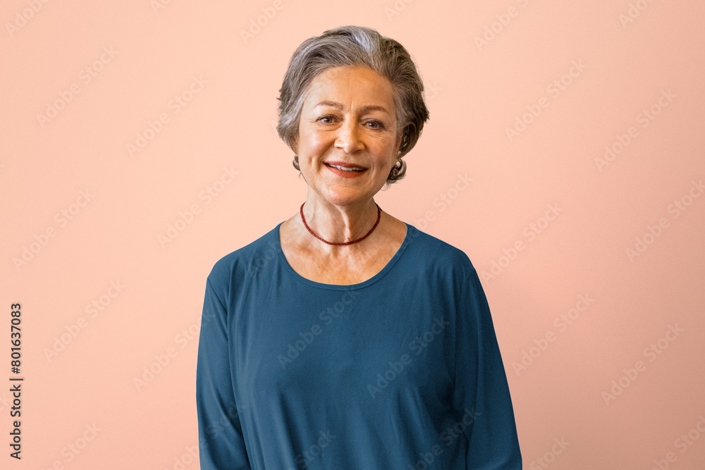 Happy senior woman, isolated on peach Happy senior woman, isolated on peach