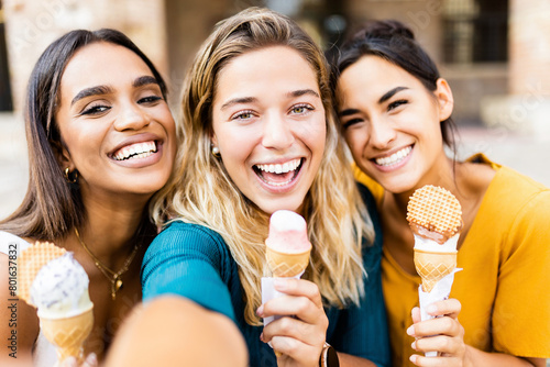 Portrait of happy multiracial women eating ice cream during summer vacation on Italy. Travel and holiday lifestyle concept