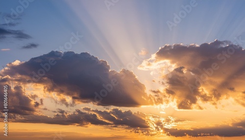 sunset sky with clouds and sun rays