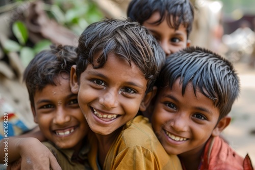 Group of indian kids looking at camera with smiles. Selective focus. © Igor