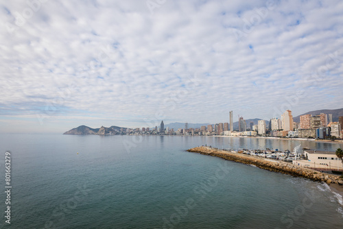 Benidorm,Alicante,Spain.Aerial photo from drone to Benidorm city skyline with beach and mountains in the background. December 6, 2022