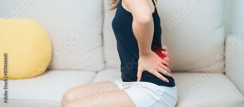 woman having back body ache during at home. adult female with muscle pain due to Piriformis Syndrome, Low Back Pain and Spinal Compression. Office syndrome and medical concept