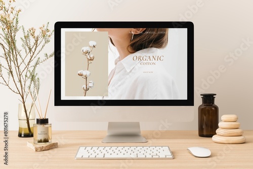 Computer desktop, online organic clothes shop, minimal workspace photo