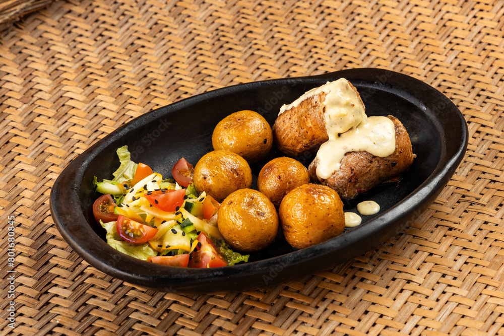 oven-roasted trout rolls, bathed with Paipa cheese - Yellow potatoes with vegetable salad - Gastronomy of Boyaca, Colombia oven-roasted trout rolls, bathed with Paipa cheese - Yellow potatoes with vegetable salad - Gastronomy of Boyaca, Colombia