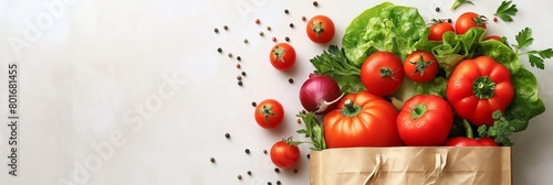 A paper shopping bag filled with vegetables on a white background, presented as a flat lay. The bag is filled with fresh and colorful produce, surrounded by ingredients floating in the air.