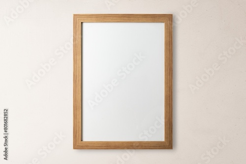 Blank wooden frame, beige wall © Rawpixel.com