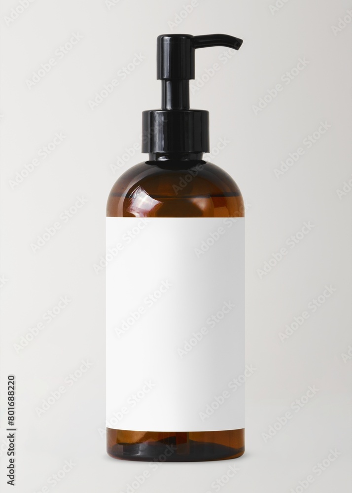 Brown dispenser bottle, blank white label, skincare product packaging Brown dispenser bottle, blank white label, skincare product packaging