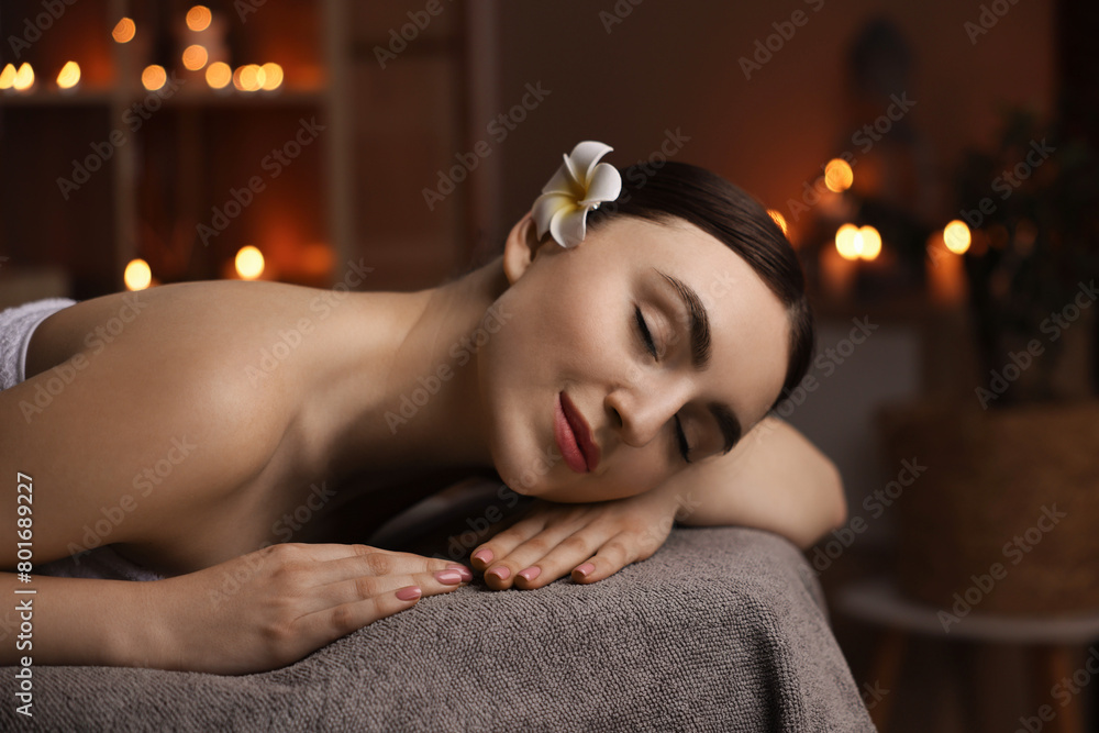 Spa therapy. Beautiful young woman lying on massage table in salon Spa therapy. Beautiful young woman lying on massage table in salon