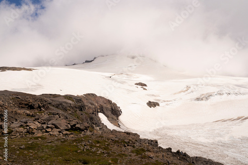 View of Glacier Alerce in Tronador hill in the Andes cordillera. The beautiful white clouds, ice field and mountain. 