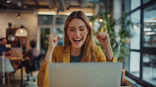 cheerful business woman with laptop and gesturing yes, shaking fists celebrating great luck online sitting in modern office inside, surrounded by coworkers. generative AI