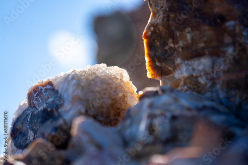 close up of rocks with visible crystals backlit by the sun