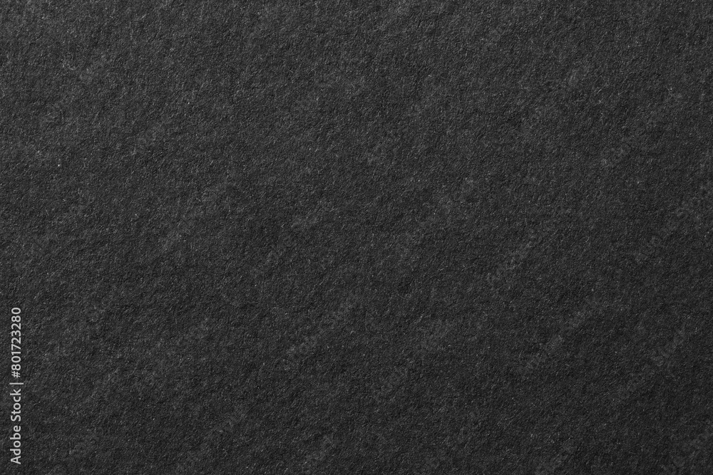 Black background, rough paper texture