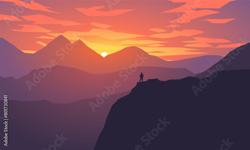 Vector mountain landscape with a man standing on the top ofthe hill © Johnster Designs