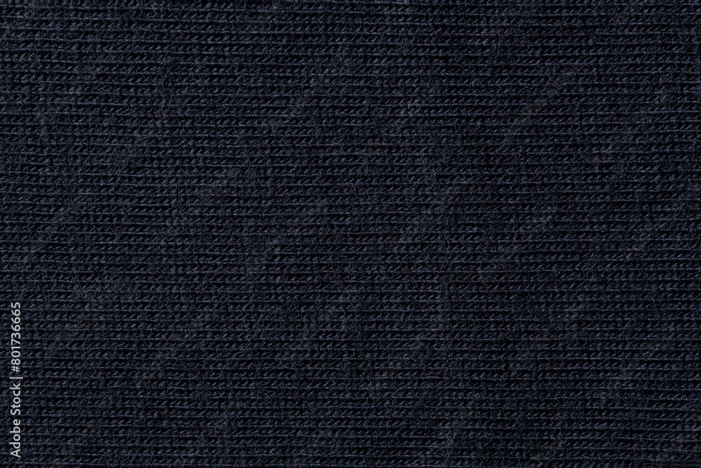 Black background, knitted fabric texture, macro shot design Black background, knitted fabric texture, macro shot design
