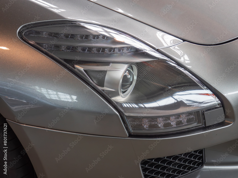 Close-up of Luxury Car Headlight and Grille