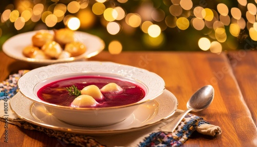 Fototapeta Naklejka Na Ścianę i Meble -  Traditional polish christmas eve dinner barszcz and uszka on wooden table with beautiful christmas decorations, copy space