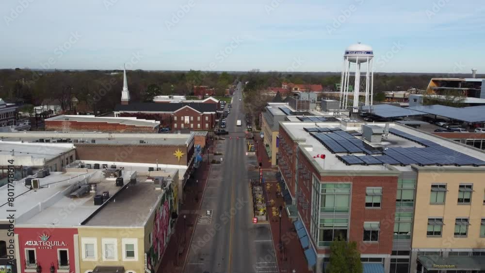drone approaching Bentonville in Arkansas with the main tower and road drone approaching Bentonville in Arkansas with the main tower and road