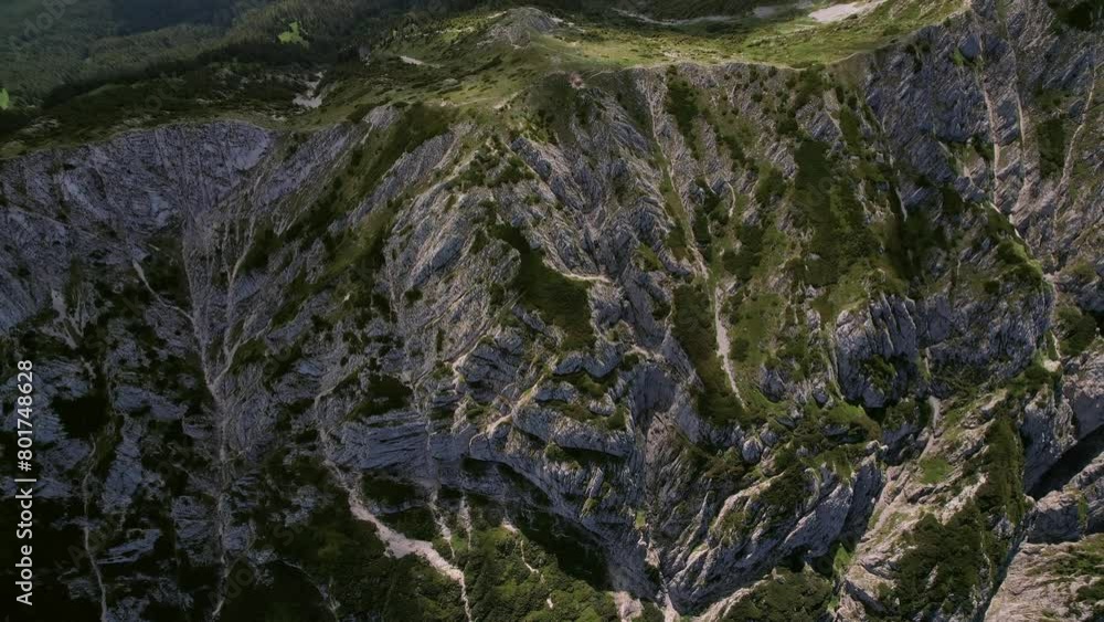 The rugged piatra craiului mountains under bright sunlight, highlighting textures, aerial view The rugged piatra craiului mountains under bright sunlight, highlighting textures, aerial view
