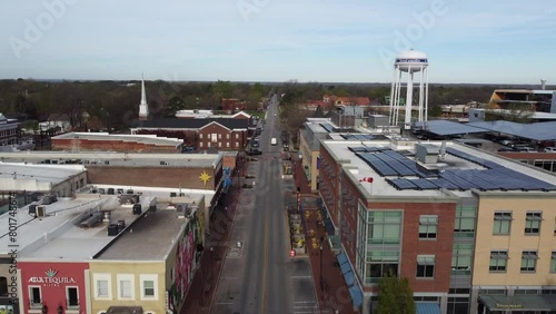 drone approaching Bentonville in Arkansas with the main tower and road  photo