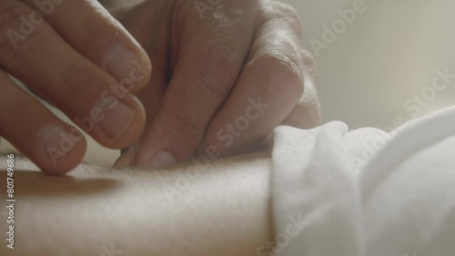 Man Inserting Needle Into Woman's Back
