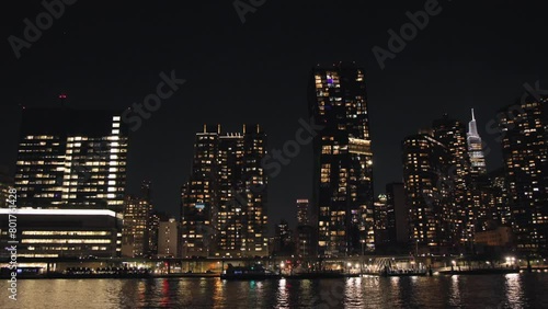 Twilight New York City against the backdrop of the river and beautiful bright skyscrapers. Lively traffic on the streets. USA. NY. High quality 4k footage photo