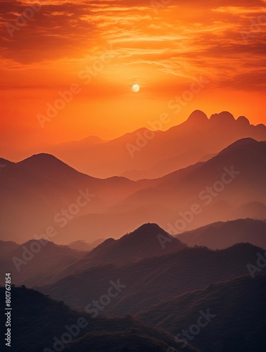 The image shows a beautiful sunset over a mountain range © stockpro