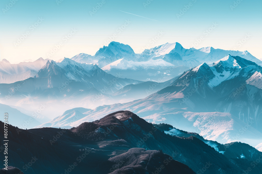 Majestic mountain range with snow peaks during sunrise, panoramic view