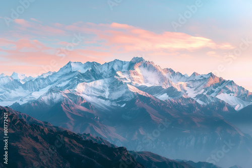 Majestic mountain range with snow peaks during sunrise, panoramic view