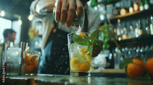 A closeup shot of a bartender skillfully muddling ingredients for a mocktail. photo
