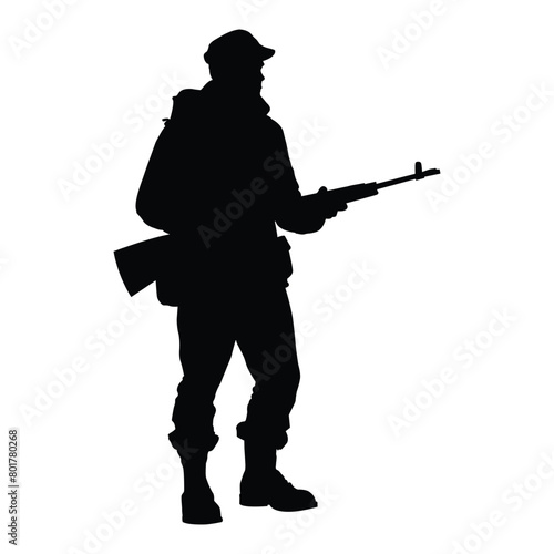 silhouette of a man holding rifle