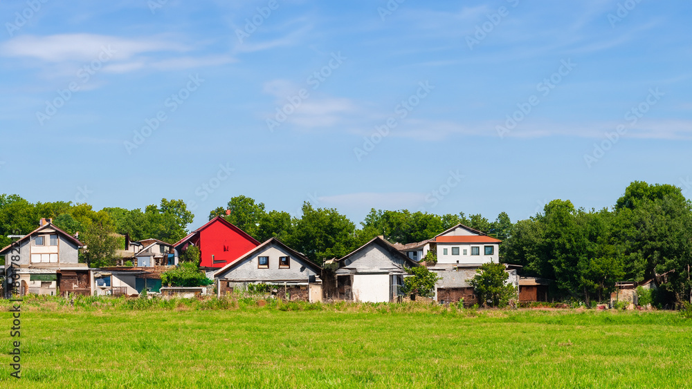 Small villages home on the wide grass field . Generative Ai