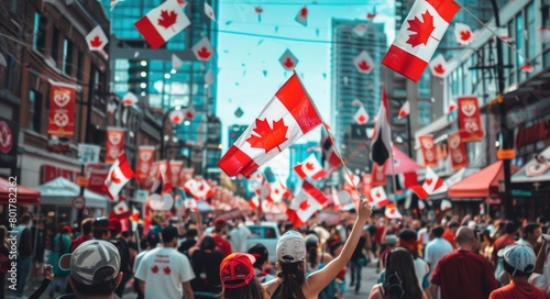 Celebratory Crowd Waving Canadian Flags on City Street photo