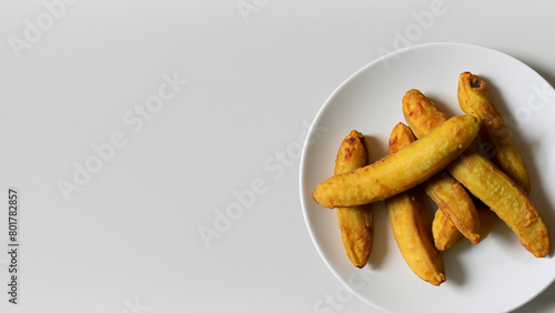 banana fried, pisang goreng from indonesian on white white plate. Generative Ai photo