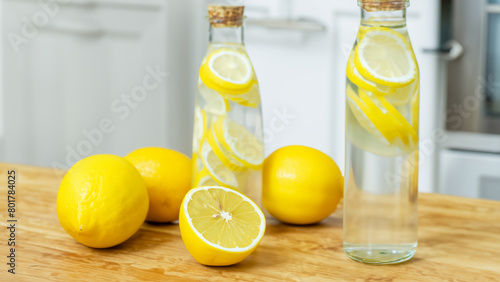 lemon insfus water bottle on the wooden table top and kitchen background. Generative Ai