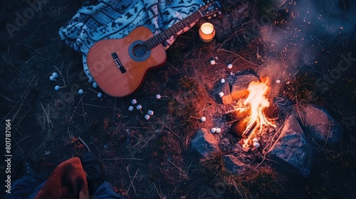 A Tartan guitar lies beside a blazing campfire, adding a touch of plaid pattern to the rustic setting. The warm glow of the fire creates a cozy atmosphere for recreational musicmaking AIG50
