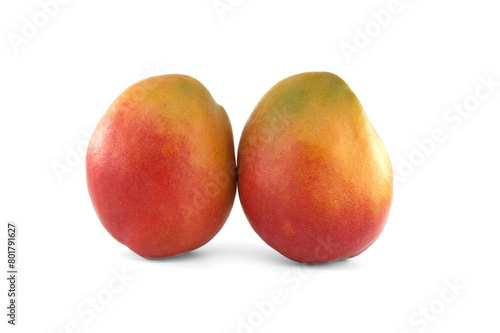 Two ripe vibrant colors mango fruits isolated on white background