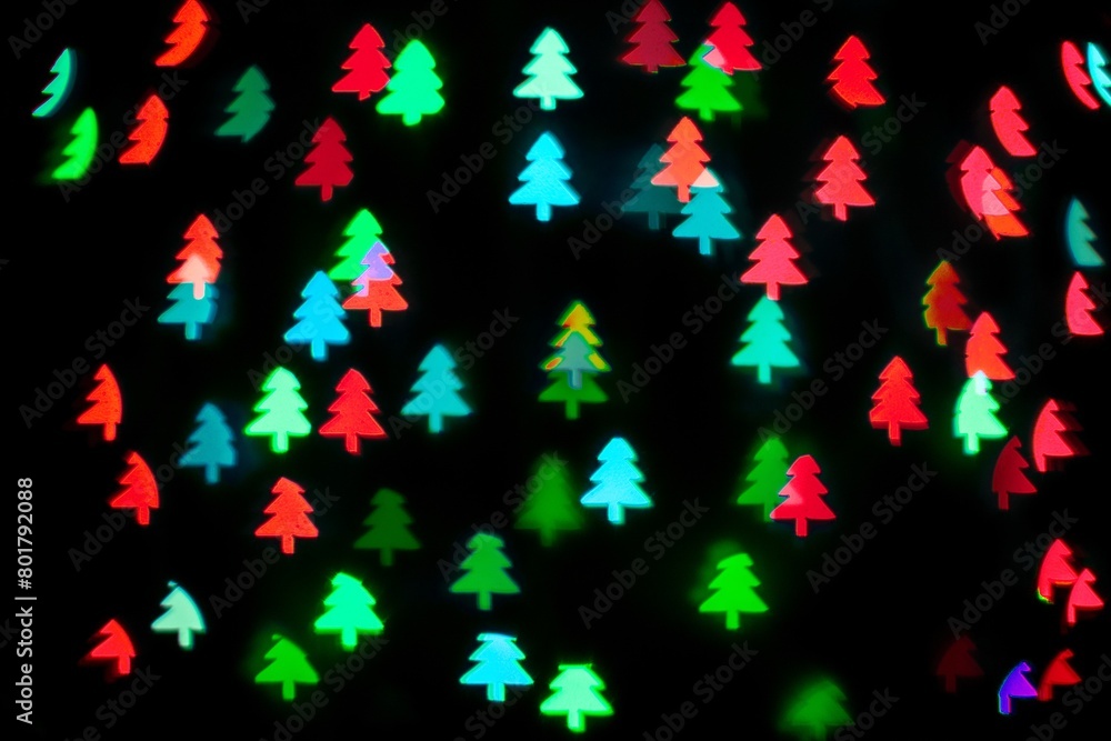 Green red glitter Christmas tree bokeh sequin confetti on black background