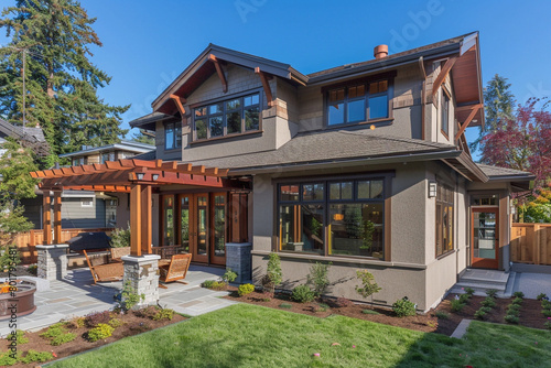 A two-story Craftsman home with a mix of stucco and wood siding, detailed trim around windows and doors, and a spacious backyard with a custom pergola and fire pit.