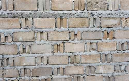 Old brick wall texture background with stone and concrete elements