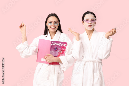 Young women in bathrobes wi...