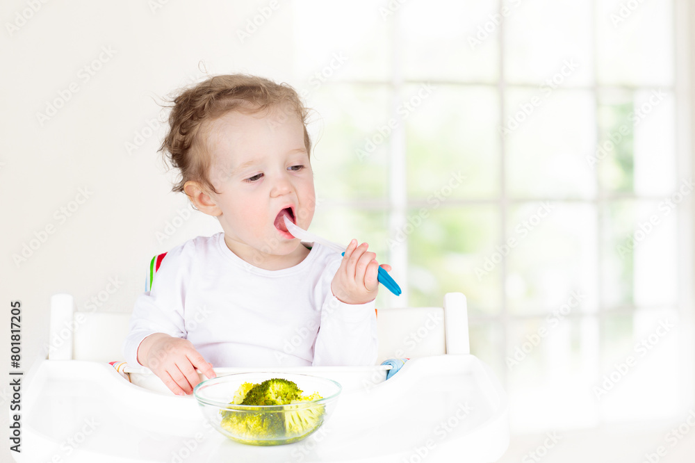 Baby eating vegetables. Solid food for infant. Baby eating vegetables. Solid food for infant.