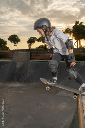 Boy jumping off the ramp with his skateboard