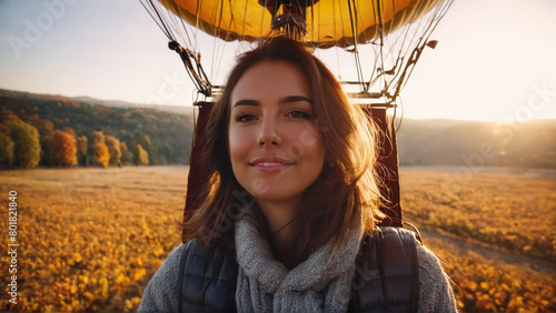 Relaxed woman enjoying a scenic hot air balloon ride autumn landscape unfolding gentle float warm