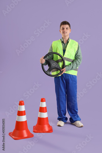 Teenage worker with steerin...