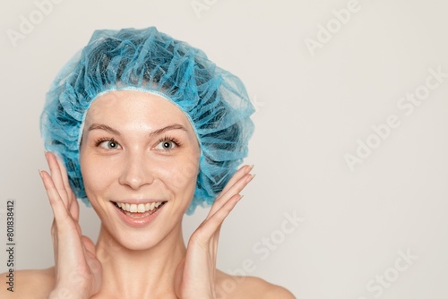 Woman in hairnet at beauty clinic photo