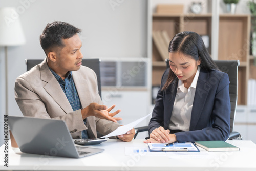 Wallpaper Mural Asian businesswoman and businessman facing workplace challenges. From age diversity to handling mistakes and consequences like bankruptcy, emphasizing accountability, and learning from errors. Torontodigital.ca