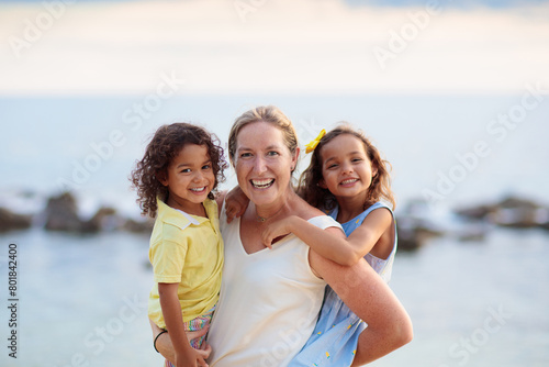 Mother and kids on tropical beach. © famveldman